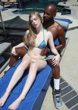 Sexy white blonde gives a hot footjob to a black dude before having interracial sex